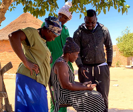 Photo of farmers playing the game in a playsession in the Zimbabwe project